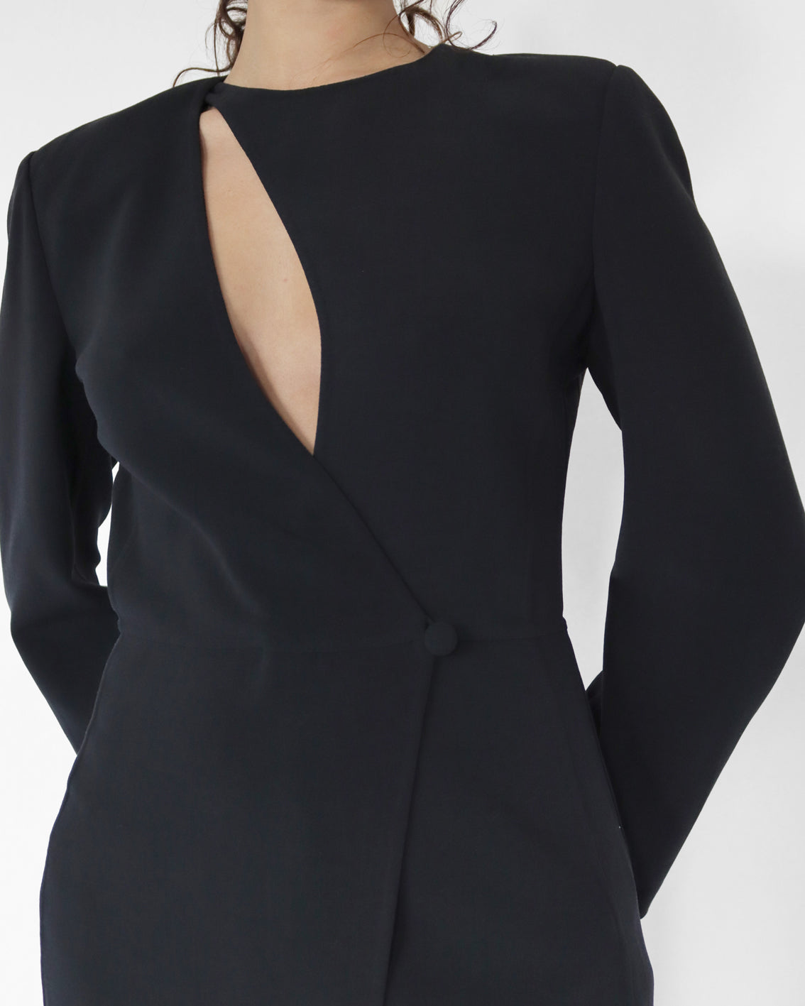 Tailored asymmetric cut out top in black stretch wool