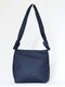 ‘Wander’ knot crossbody bag in navy blue silk